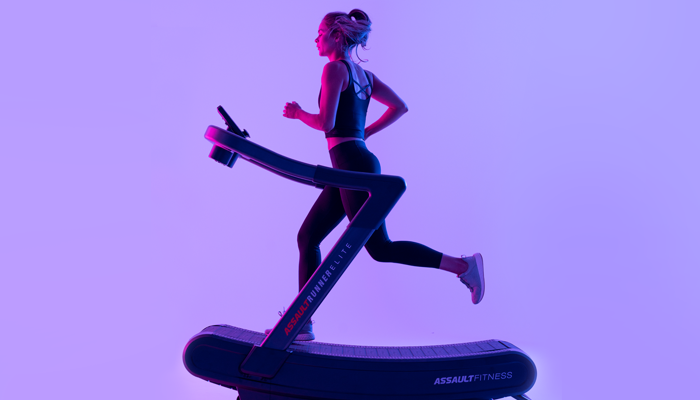 Woman running on assault runner elite treadmill